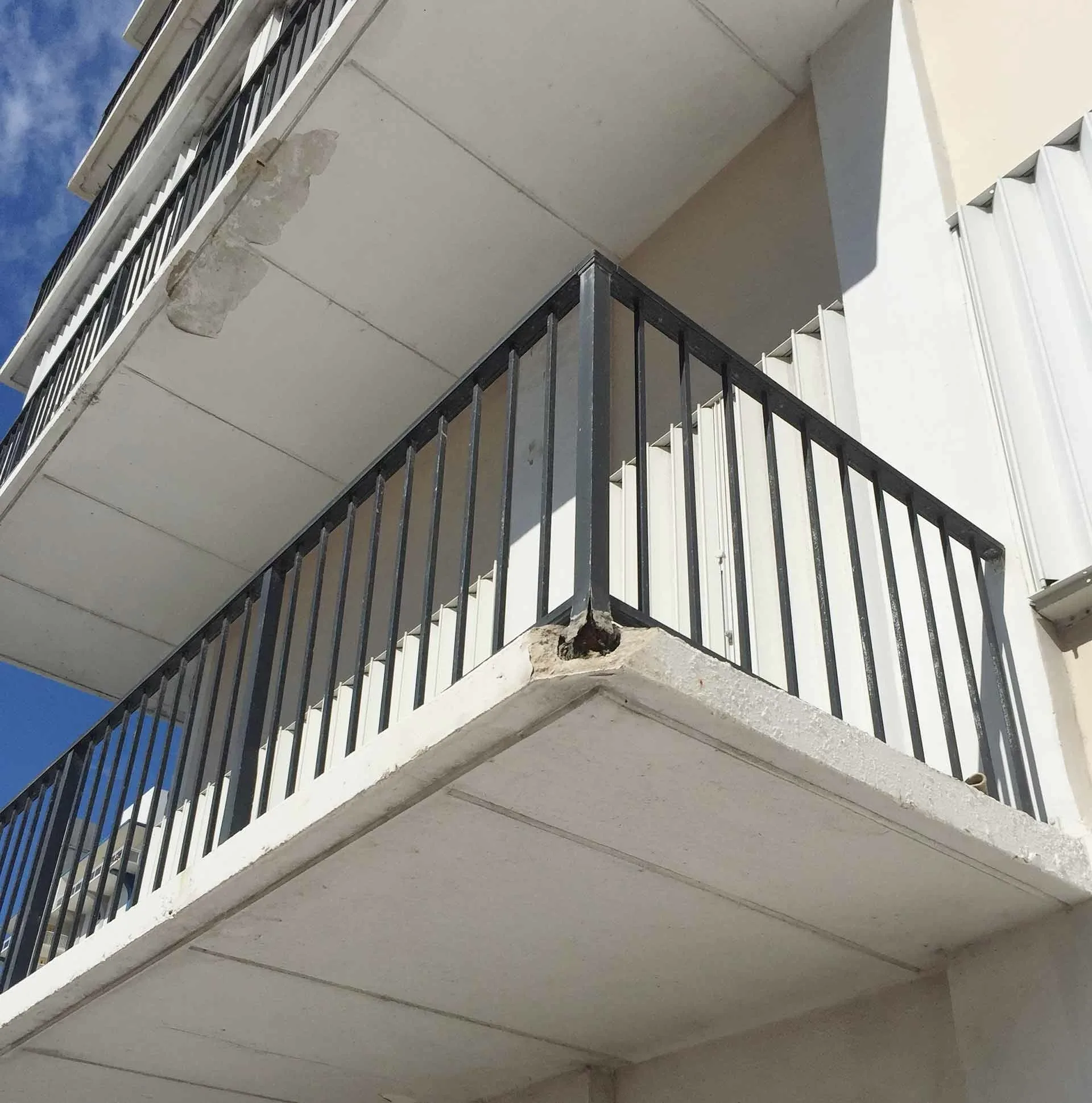 Photo of a railing failure. It will need to be replaced, and until it is, it can be quite dangerous.