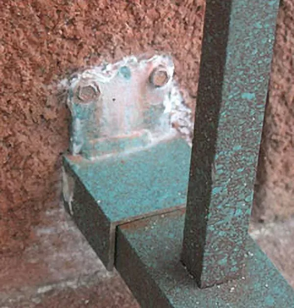 Galvanic corrosion on a railing.