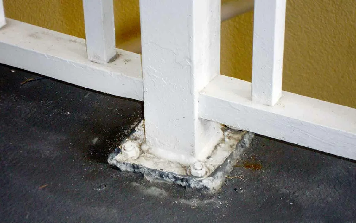 Plate-mounted railings bring unwanted moisture into the concrete below.