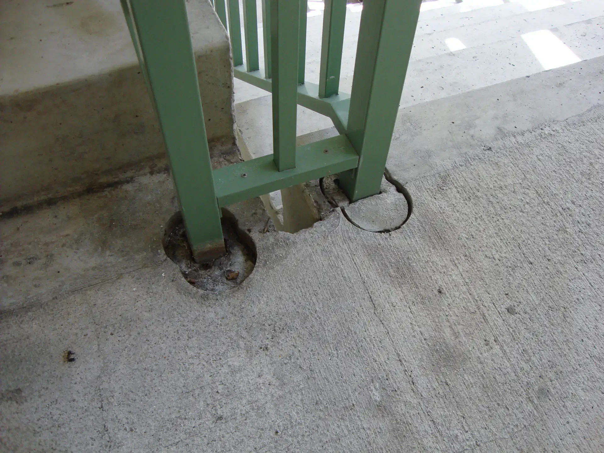 Example of a rail post failure, embedded directly in the concrete.